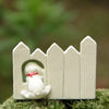 Climb The Fence Dog Puppy Figurine